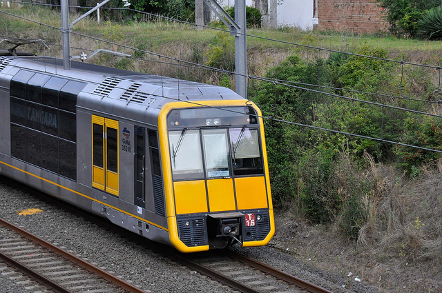 Grey and yellow train on a track