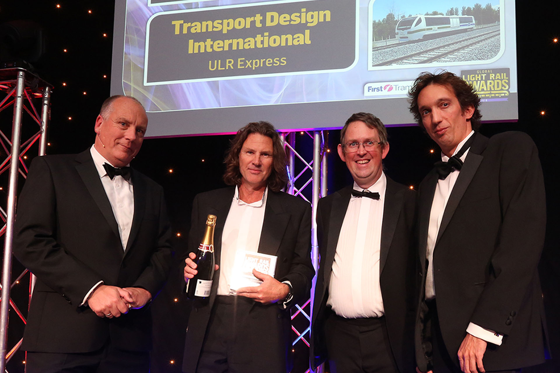 Global Light Rail Award winner 2016-hero A group of people posing at an award celebration