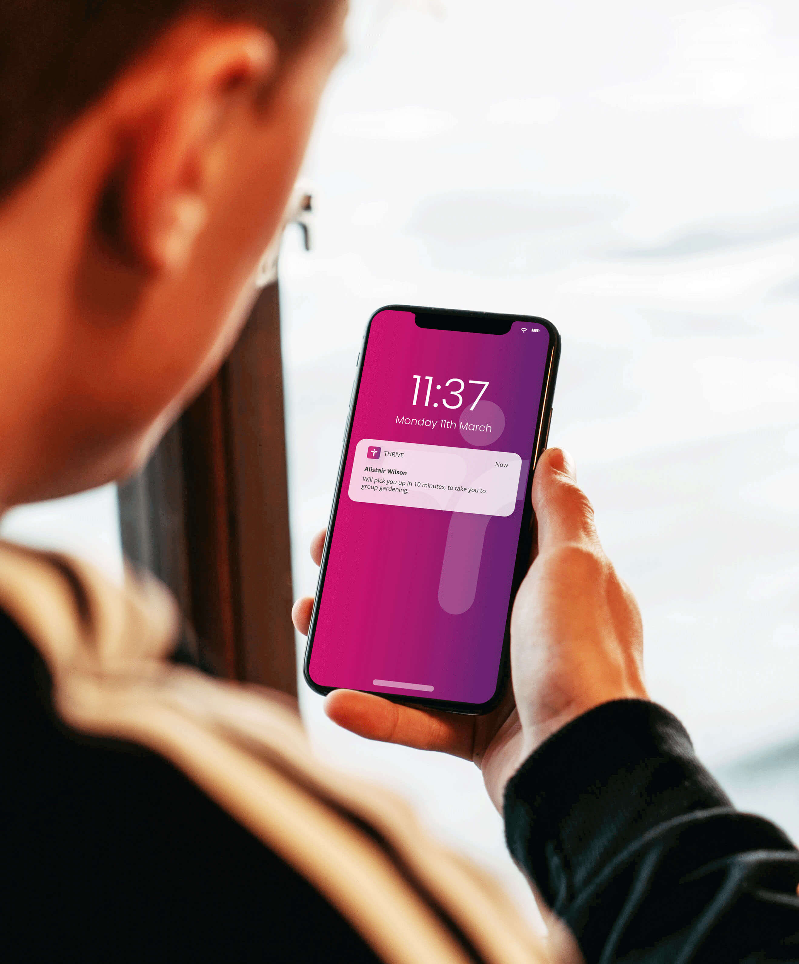 Thrive-feature-img Men looking at mobile phone screen